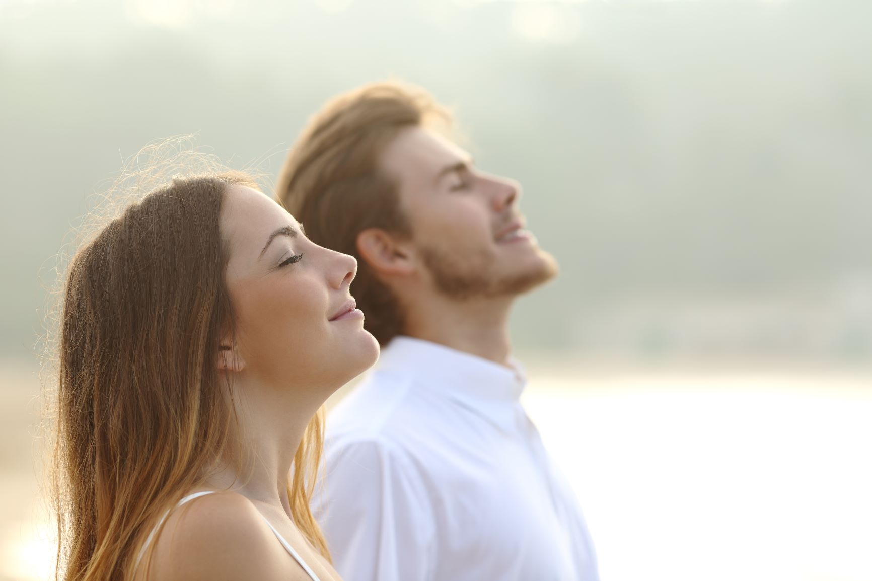  A Man And Woman Taking Deep Breaths