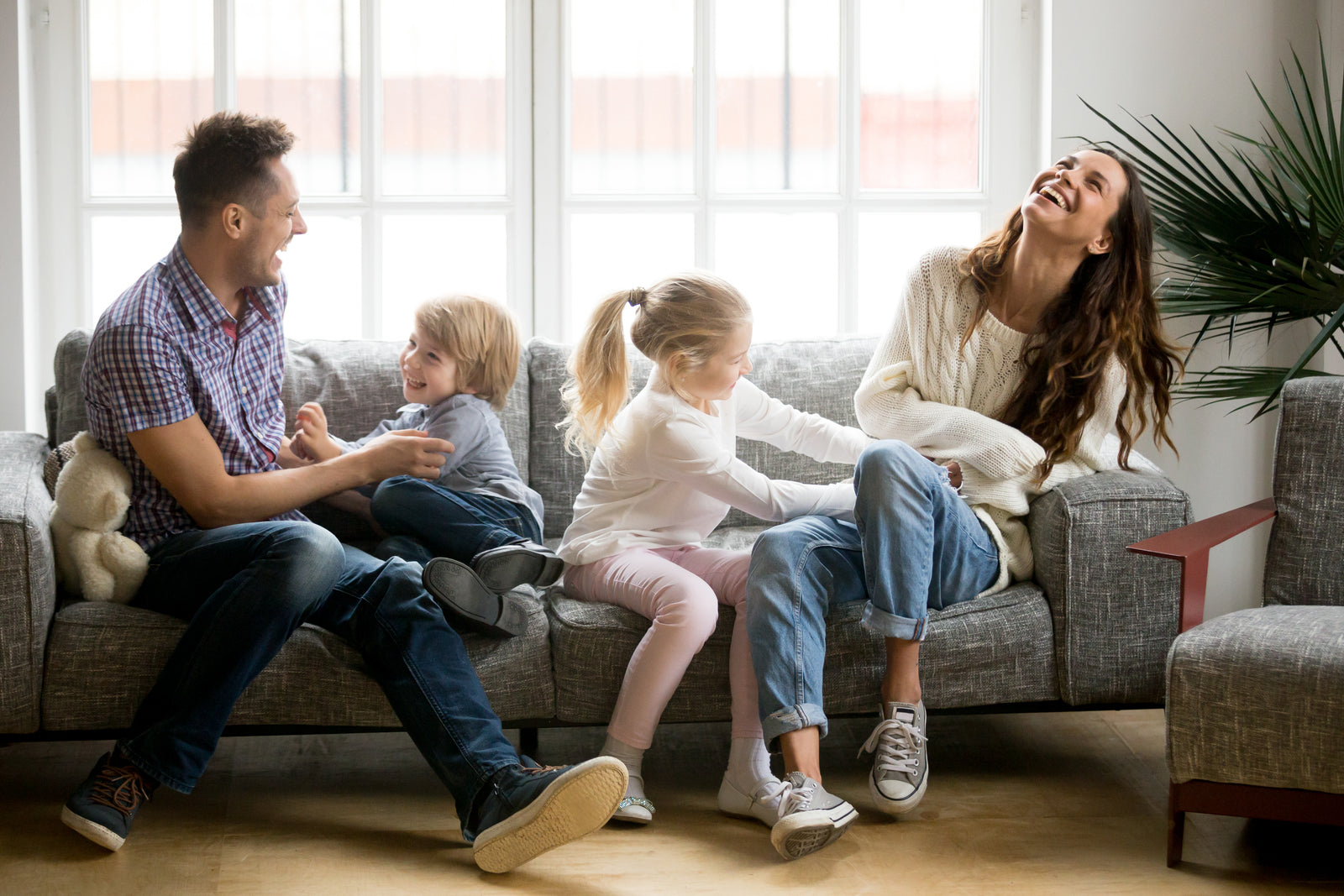 Family Hanging Out On The Couch