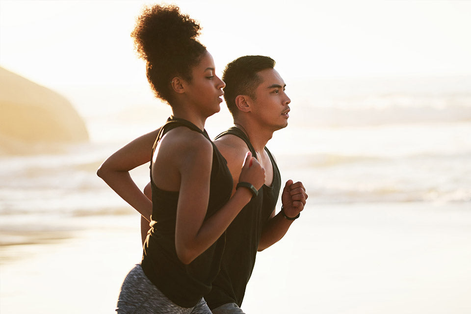 a couple joging on beach